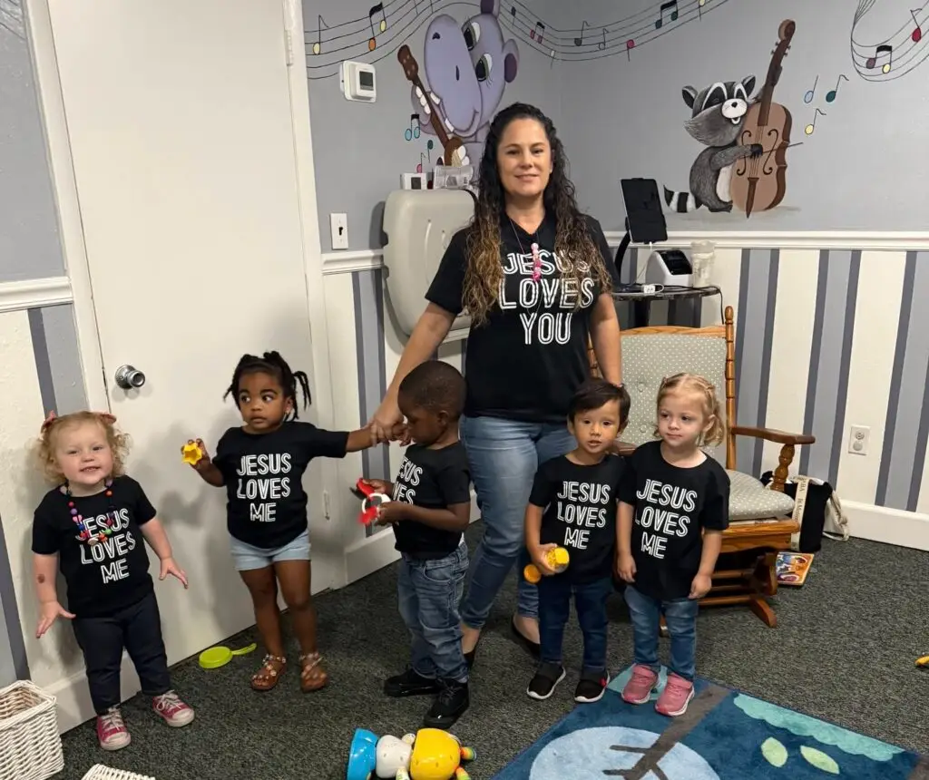 Preschool teacher leading a group of young children in a classroom at Bethany Christian Preschool in West Melbourne, FL.